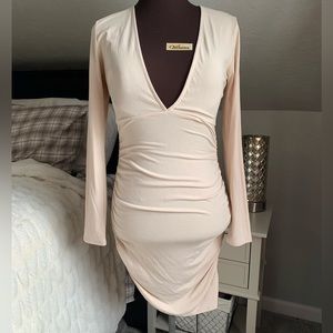 Keshia bodycon deep V dress with ruching in all the right spots!